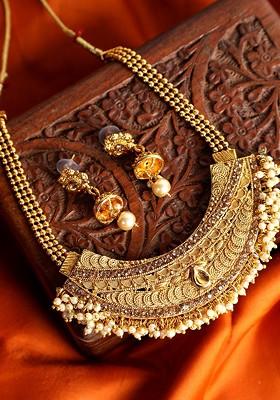 Gold Plated Off White And Yellow Stone Studded And Pearl Beaded Handcrafted Ganthan Jewellery Set