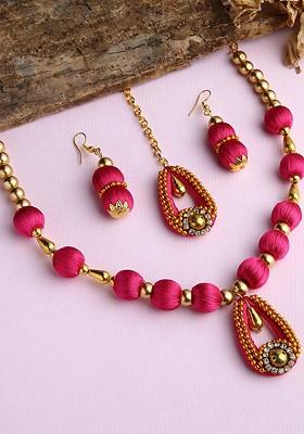 Gold Plated Pink And White Stone Studded And Beaded Jewellery Set