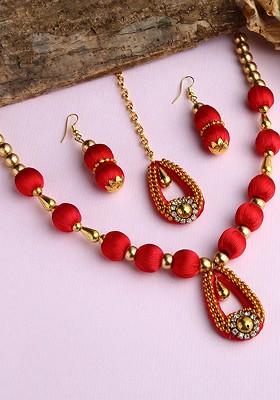 Gold Plated White  Stone Studded Red Wooden Balls Silk Thread Jewellery Set