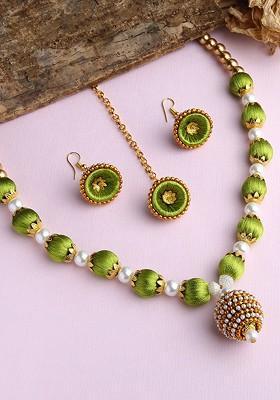 Gold Plated White And Green Stones Studded And Beaded Wooden Balls Silk Thread Jewellery Set