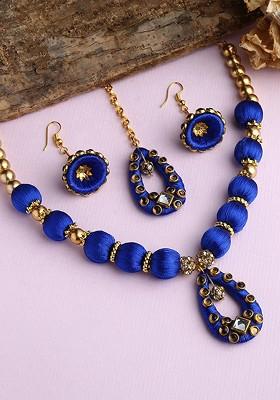 Gold Plated White And Blue Stones Studded And Beaded Wooden Balls Silk Thread Jewellery Set