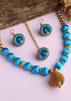 Gold Plated White And Blue Stone Studded And Beaded Wooden Balls Silk Thread Jewellery Set