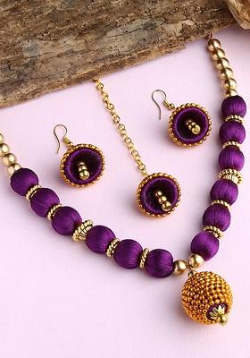 Gold Plated White And Purple Stone Studded And Beaded Wooden Balls Silk Thread Jewellery Set