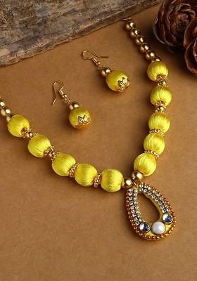 Gold Plated White And Yellow Stone Studded And Beaded Wooden Balls Silk Thread Jewellery Set