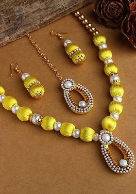 Gold Plated White And Yellow Stone Studded And Beaded Wooden Balls Silk Thread Jewellery Set