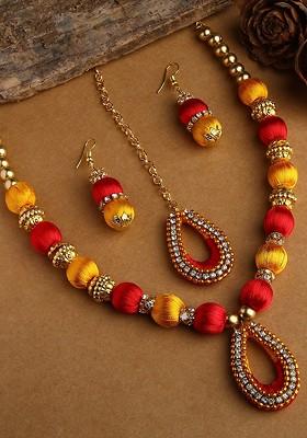 Gold Plated White And Yellow Stone Studded And Beaded Thread Jewellery Set