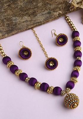 Gold Plated White And Purple Stone Studded And Beaded Wooden Balls Silk Thread Jewellery Set