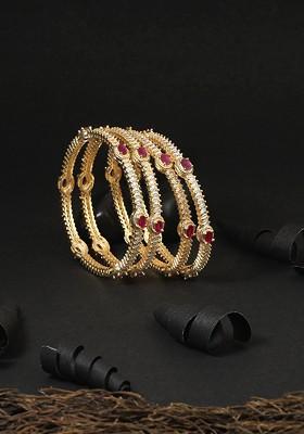 Woman Set Of 4 Gold Plated White Stone Studded Bangles