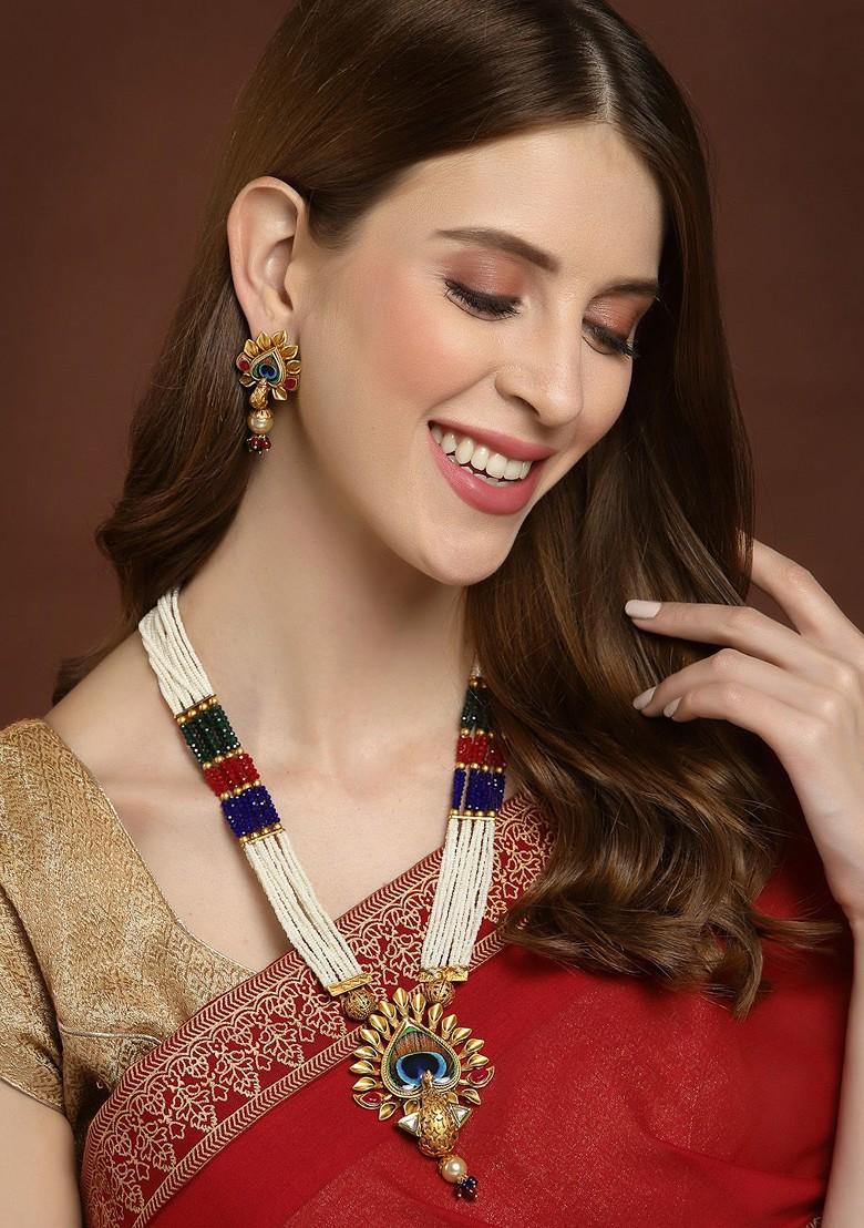 Gold Plated White And Red Stone Studded And Pearl Beaded Jewellery Set