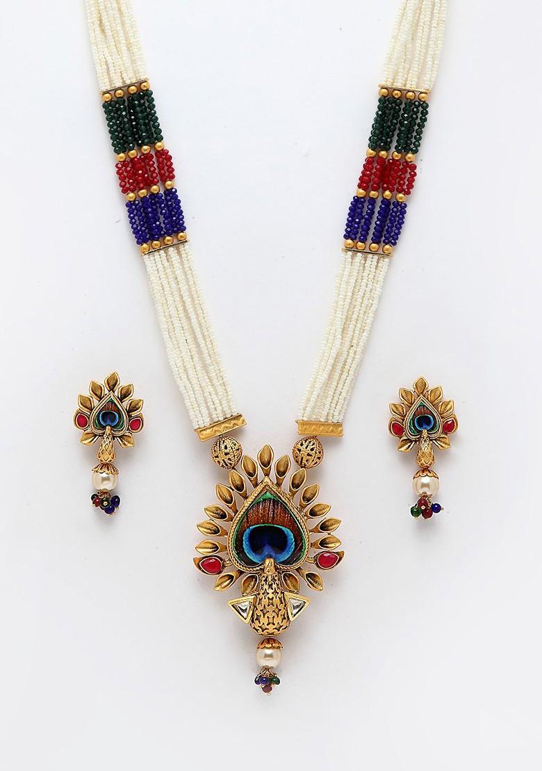 Gold Plated White And Red Stone Studded And Pearl Beaded Jewellery Set