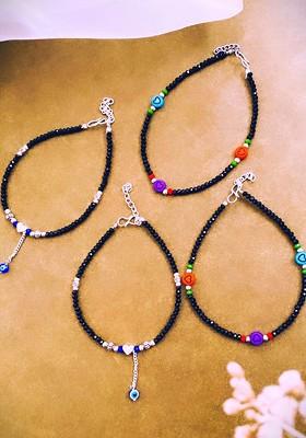 Set Of 4 Silver Plated Stone Studded And Beaded Anklets
