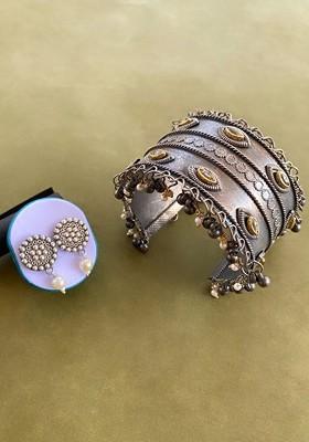 German Silver Plated Stone Studded Floral Shaped Ghunghroo Earrings And Bangle