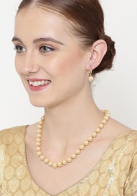 Gold Toned Pearl Studded Handcrafted Jewellery Set