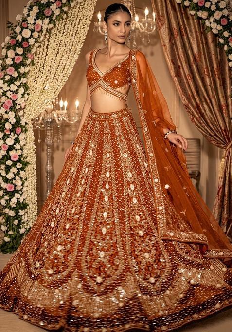 Rust Orange Embellished Bridal Lehenga Set — view on Indya