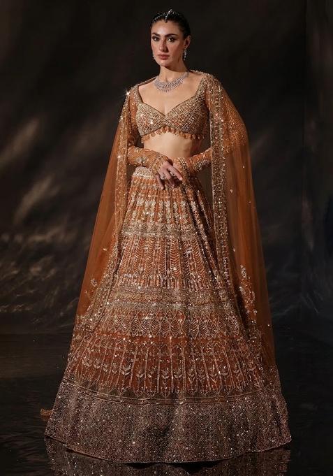 Rusty Orange Embroidered Bridal Lehenga Set — view on Indya