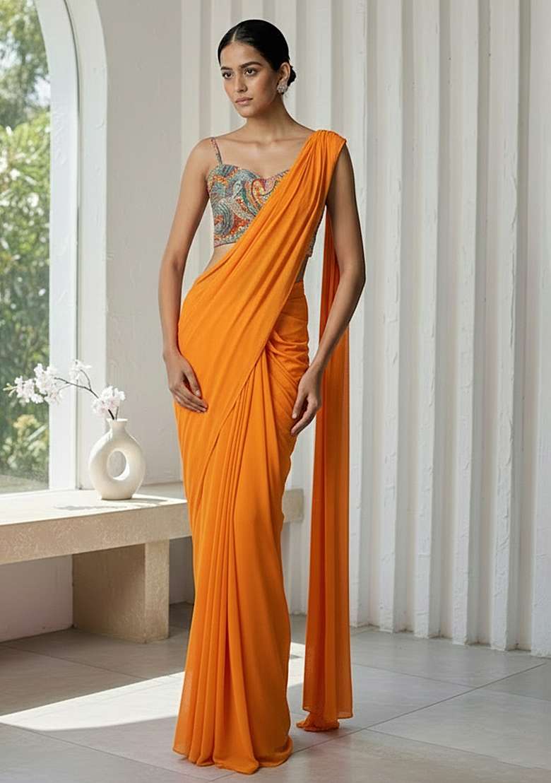 Orange Crepe Pre Draped Saree Set With Floral Printed Blouse for Diwali and Festive Wear - Indya