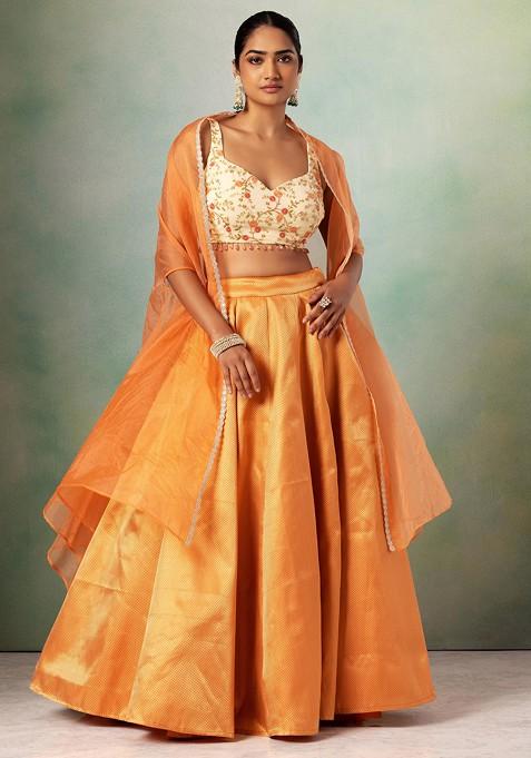 Orange Brocade Lehenga Set With Floral Embroidered Blouse And Organza Cape