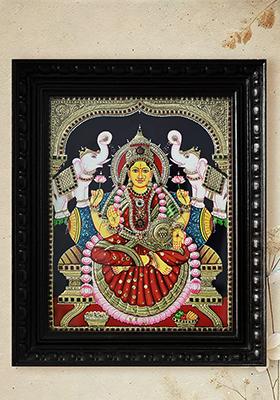 Goddess Lakshmi In Attireframed Tanjore Painting With Divine Elegance