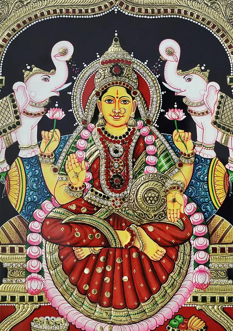 Goddess Lakshmi In Attireframed Tanjore Painting With Divine Elegance