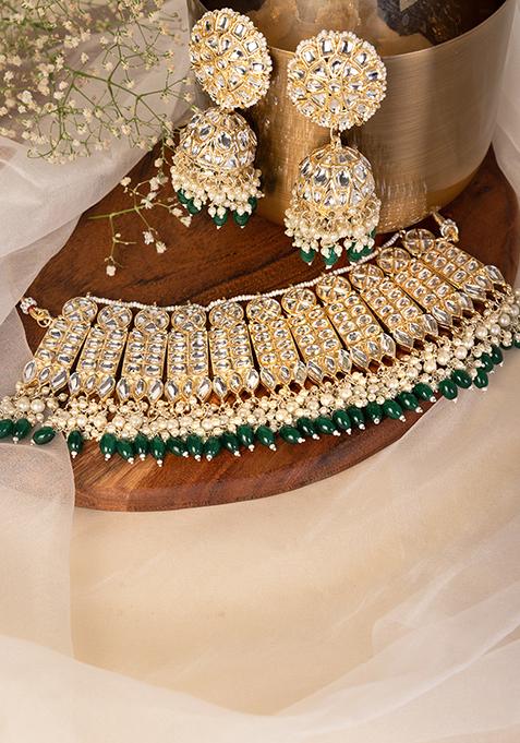 Gold Finish Kundan And Green Bead Necklace And Jhumka Earrings Set