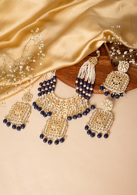 Gold Finish Kundan And Blue Bead Necklace And Earrings Set With Maangtika