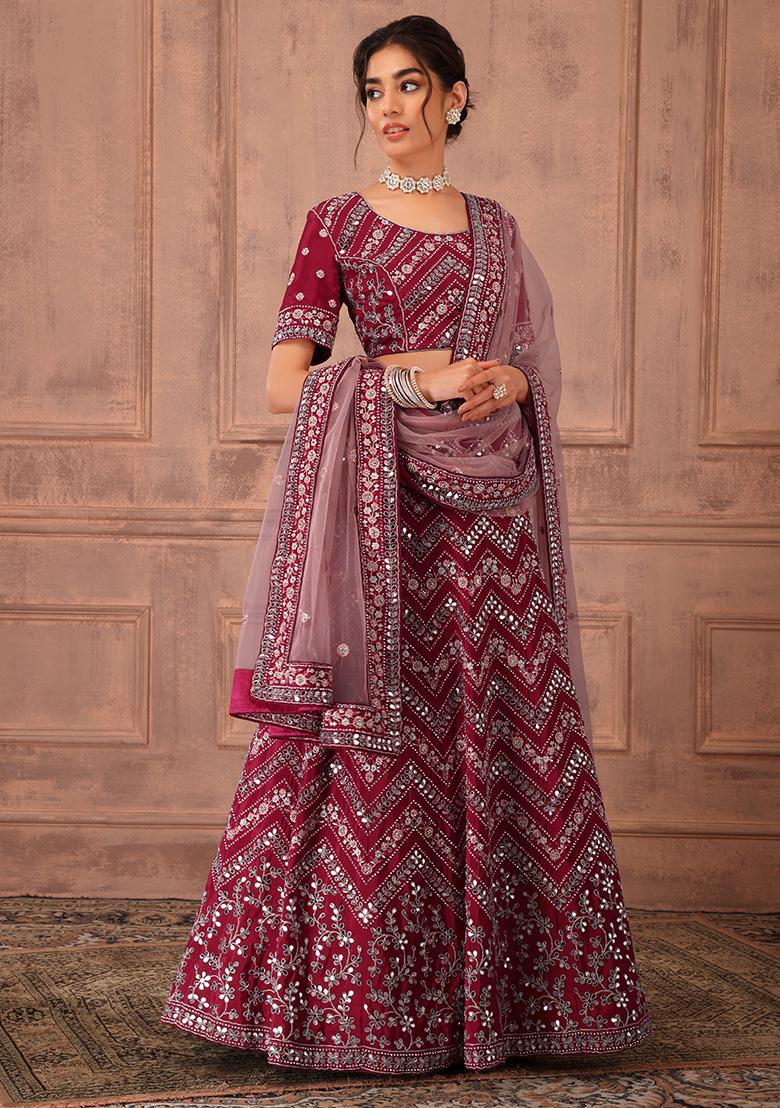 PETAL PINK LEHENGA SET WITH SELF AND SHADE COLOURED HAND EMBROIDERY PAIRED  WITH A COLD SHOULDER MATCHING BLOUSE AND DUPATTA. - Seasons India