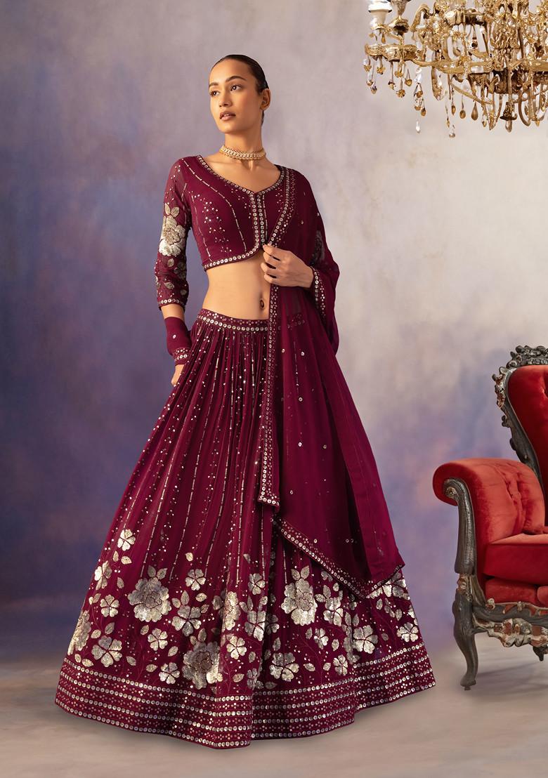 DEEP MAROON TIERED LEHENGA SET WITH A CHARCOAL ANTIQUE HAND EMBROIDERED  “ABLA” STRAPPY BLOUSE PAIRED WITH A MATCHING DUPATTA. - Seasons India