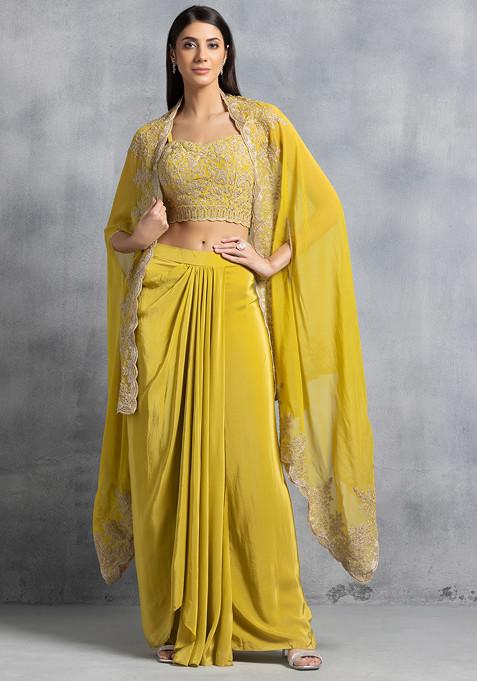 Mustard Pleated Skirt Set With Floral Thread Embroidered Blouse And Embroidered Cape