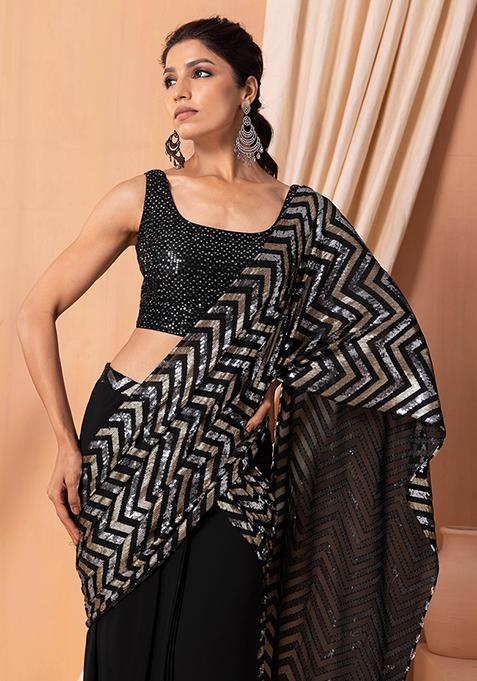 Black and white polka dot saree with an ivory blouse available only at  Pernia's Pop Up Shop. 2023