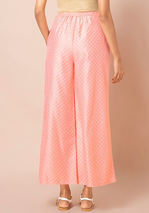 Buy Women Peach Foil Flared Palazzo Pants - Exclusive Deals - Indya