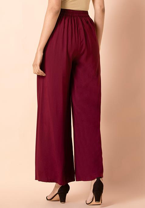 Buy Women Oxblood Solid Flared Palazzo Pants - Exclusive Deals - Indya