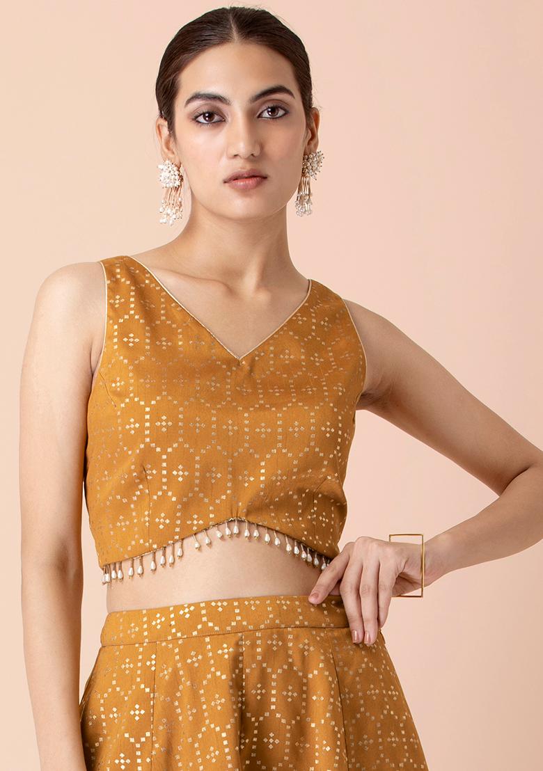 gold sleeveless crop top