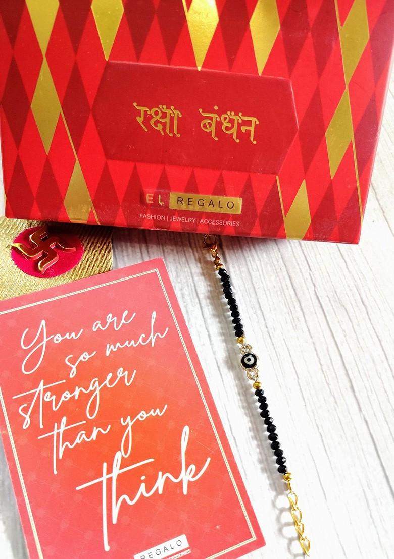 Gold Coloured Black Evil Eye Baby Rakhi With Raksha Bandhan Greeting Card - Indya