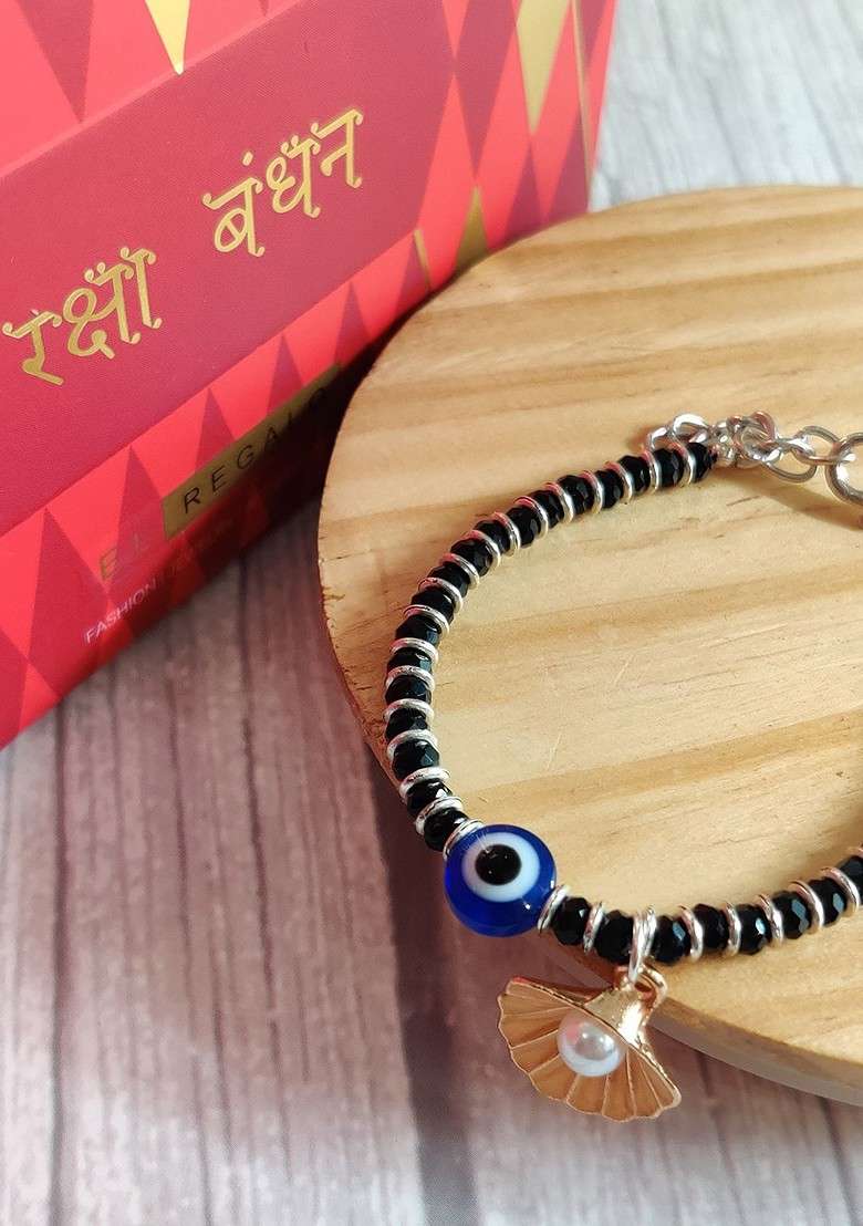 Baby Silver Coloured Blue Evil Eye Rakhi With Roli Chawal And Rakhi Card - Indya