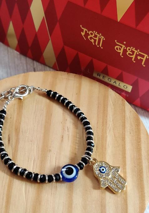 Gold Coloured Black Evil Eye Baby Rakhi With Roli Chawal Raksha Bandhan Card