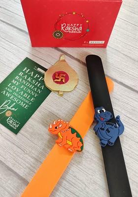 Kids Set Of 2 Orange Black Rakhi Combo With Card And Roli Chawal
