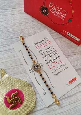 Kids Goldtoned Nazaria Rakhi Combo With Greeting Card And Roli Chawal Shagun