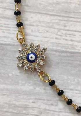 Kids Goldtoned Nazaria Rakhi Combo With Greeting Card And Roli Chawal Shagun