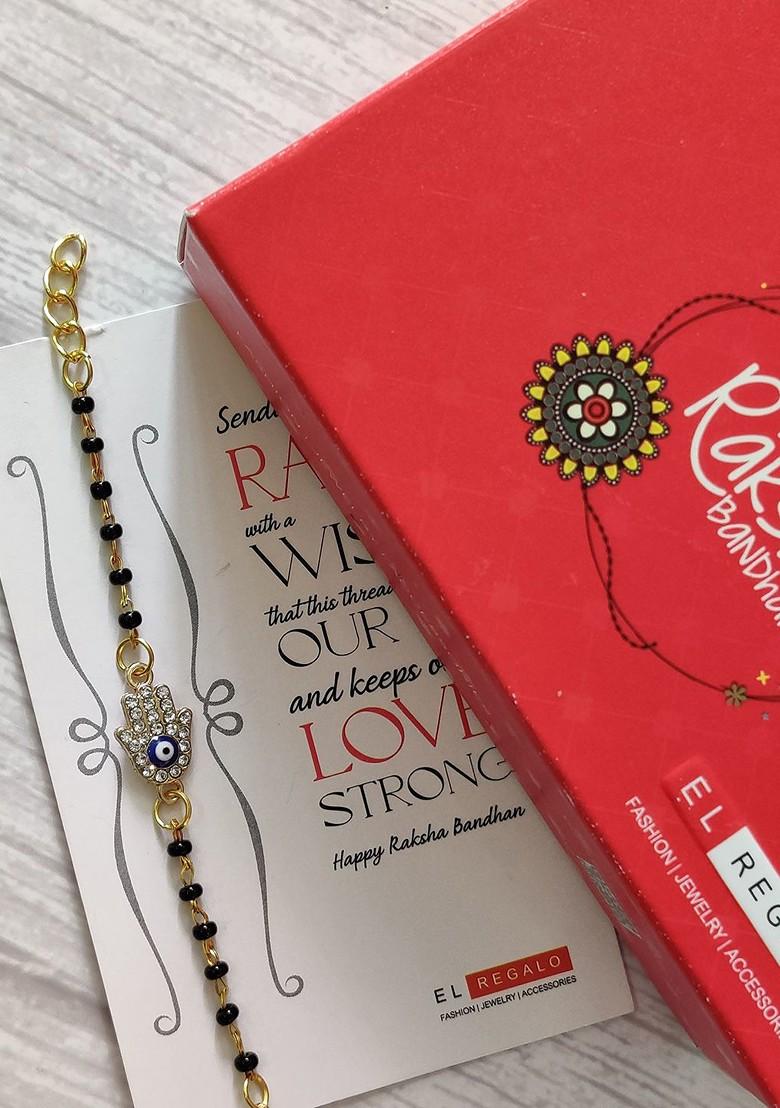 Kids Goldtoned Nazaria Rakhi Combo With Greeting Card And Roli Chawal Shagun - Indya