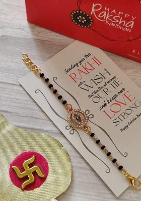 Kids Goldtoned Nazaria Rakhi Combo With Greeting Card And Roli Chawal Shagun