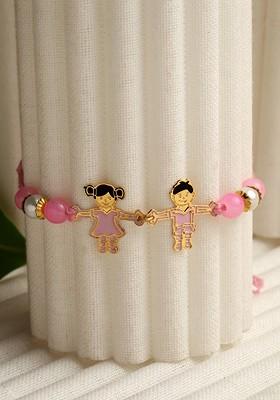 Goldtoned And Pink Brass Handcrafted Rakhi