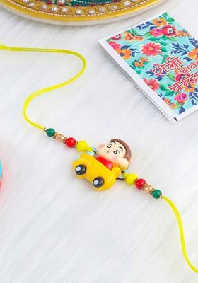 Kids Yellow Cartoon Artificial Beads Rakhi With Roli Chawal Chandan And Mishri