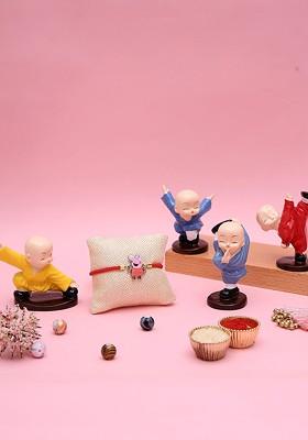 Red 7Pcs Thread Rakhi With Buddha Gift Set