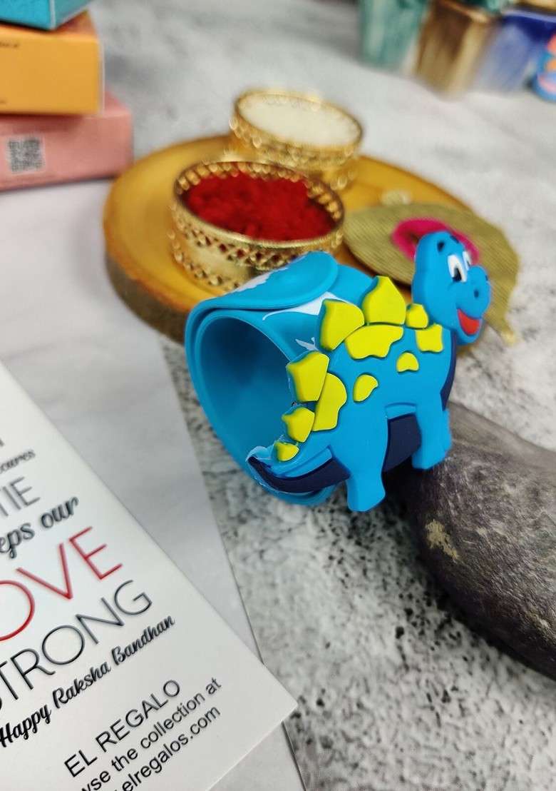 Kids Dinosaur Design Slap Band Rakhi With Roli Chawl And Card Gift Set - Indya