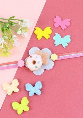 Pink Boys Donut Thread Rakhi With Roli Chawal