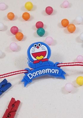 Blue Boys Doraemon Thread Rakhi With Roli Chawal And Greeting Card