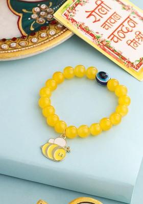 Yellow Kids Cartoon Design Yellow Artificial Beads Thread Rakhi With Roli Chawal Chandan