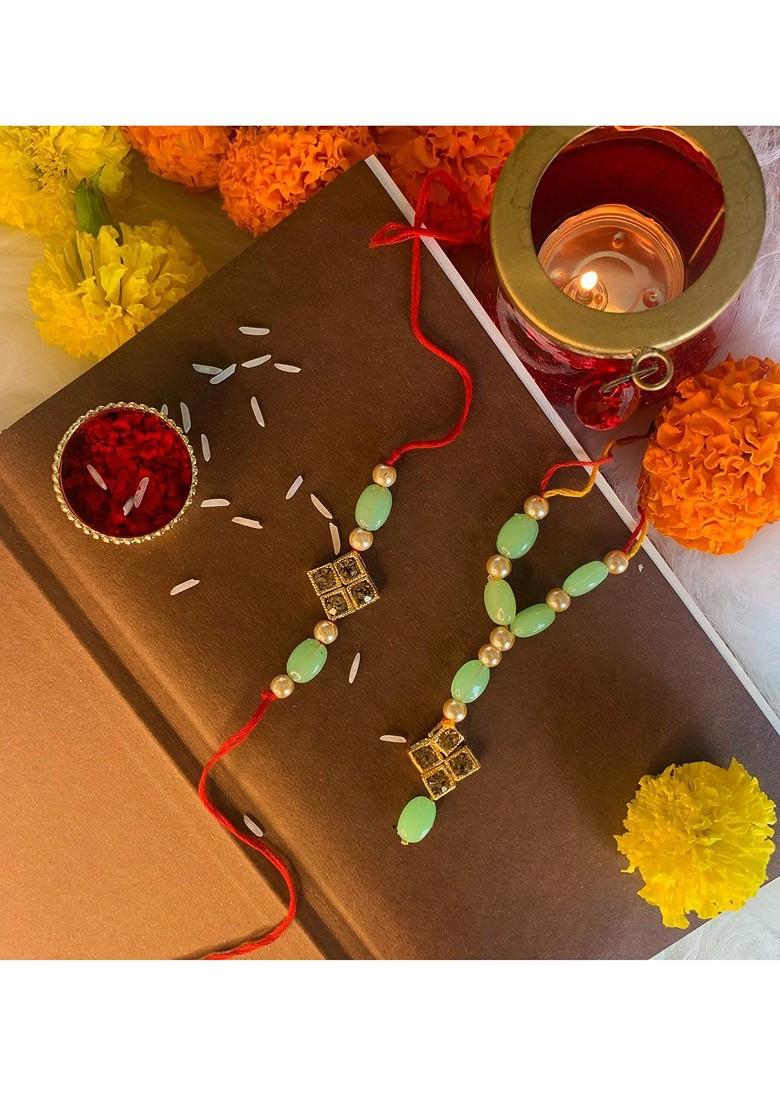 Green And Gold Toned Set 2 Pearl Studded And Beaded Lumba Rakhi With Greetings Card