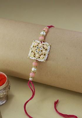 Gold Toned And Peach Coloured Beaded And Studded Rakhi