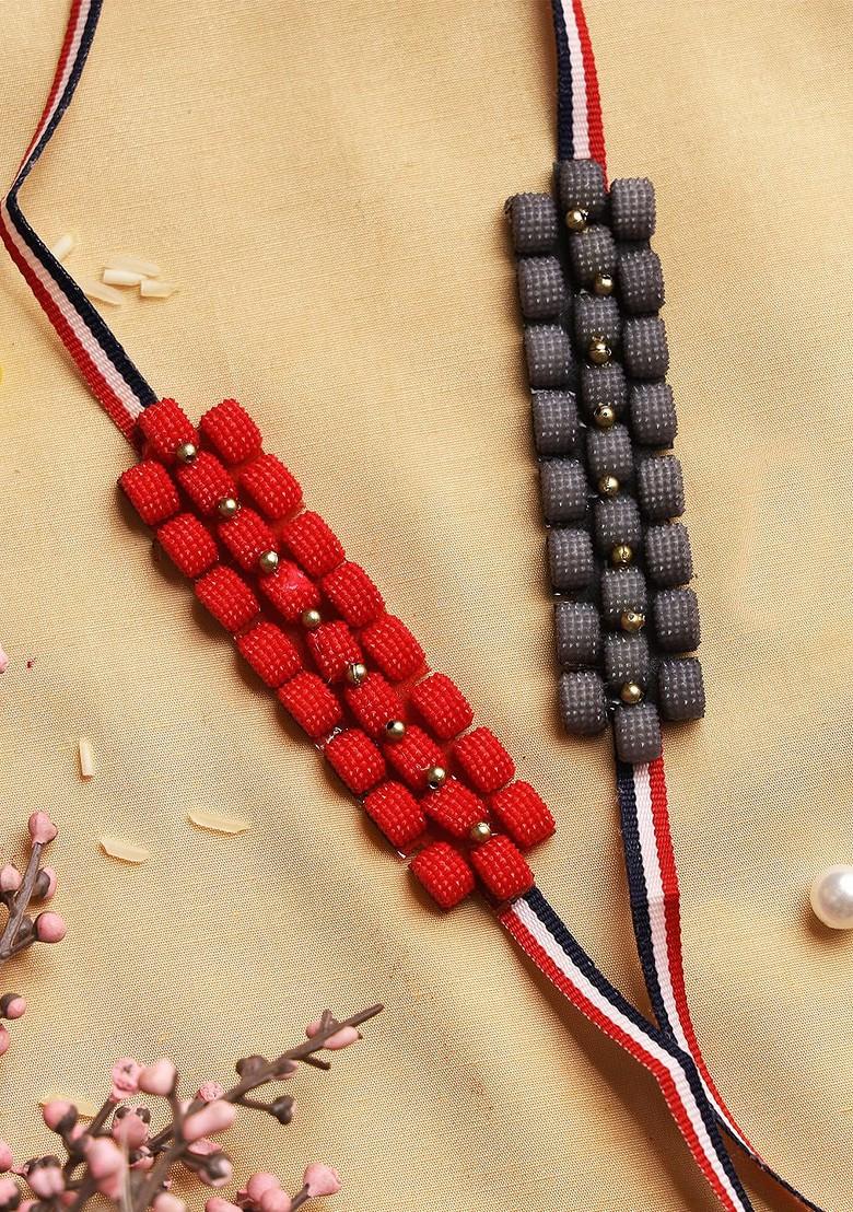 Pack Of 2 Red And Black Geometric Beaded Rakhi With Roli Chawal And Card - Indya